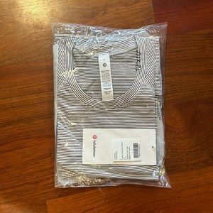 Brand new, unopened swiftly tech short sleeve shirt.